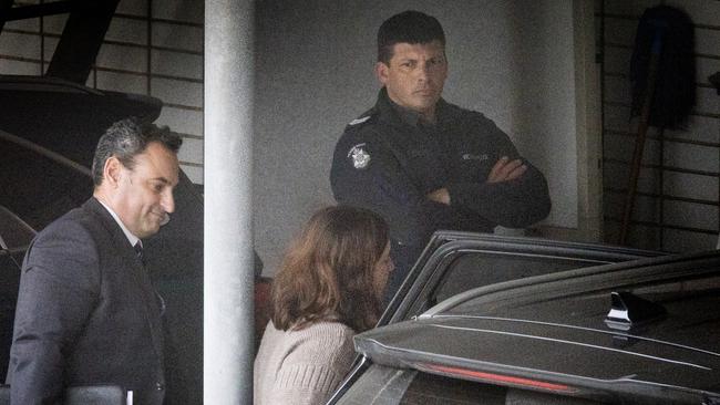 Police escort Erin Patterson into Wonthaggi police station.