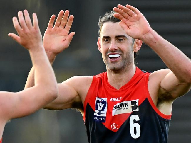 MELBOURNE, AUSTRALIA - AUGUST 27: Brodie Grundy of the Demons is congratulated by James Munro after kicking a goal during the 2023 VFL Wildcard Round match between the Casey Demons and the North Melbourne Kangaroos at Casey Fields on August 27, 2023 in Melbourne, Australia. (Photo by Josh Chadwick/AFL Photos via Getty Images)