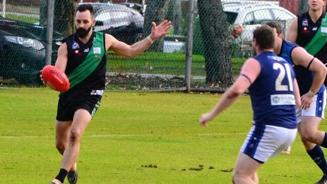 Matt Gibson boots one of his 11 majors against Flinders Uni in round nine. Picture: Michelle Adey