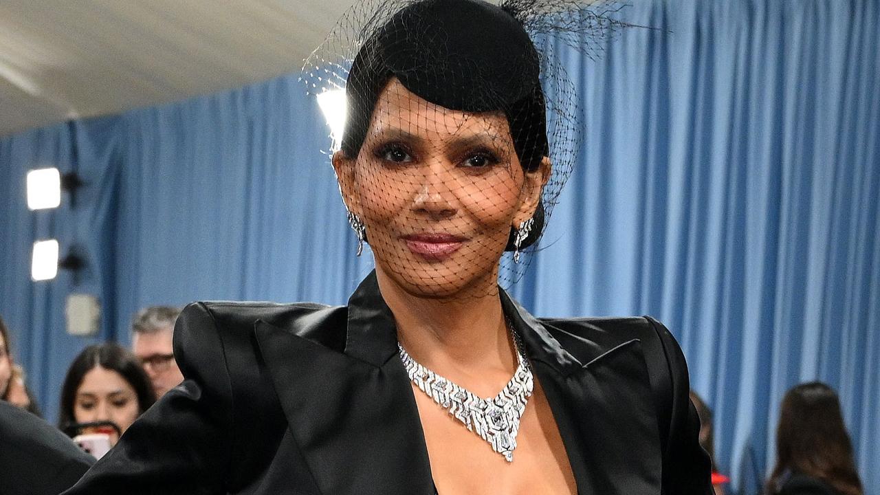 Risky move: Halle Berry almost bares all in daring dress