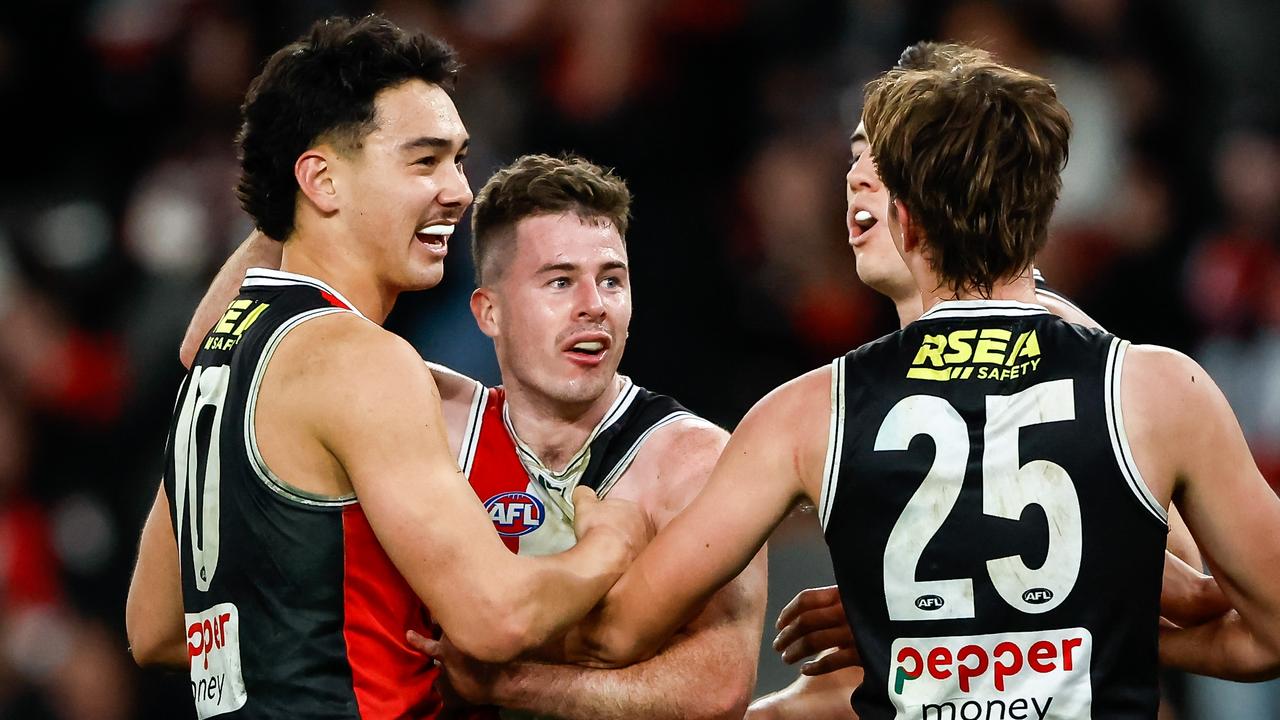 Jack Higgins celebrates the match winner with teammates. Picture: Dylan Burns