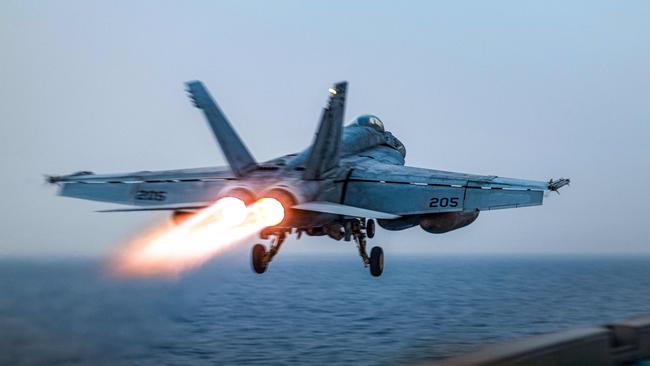 A US F/A-18 Super Hornet attack fighter jet taking off from the US Navy's Nimitz-class USS Harry S. Truman aircraft carrier at sea. Picture: AFP