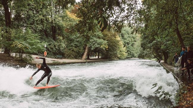 Mick Fanning is seen surfing the Eisbach, a man-made river that generates a permanent wave in the English Gardens in Munich, Germany on September 29, 2017. Photo: Cory Wilson/Red Bull