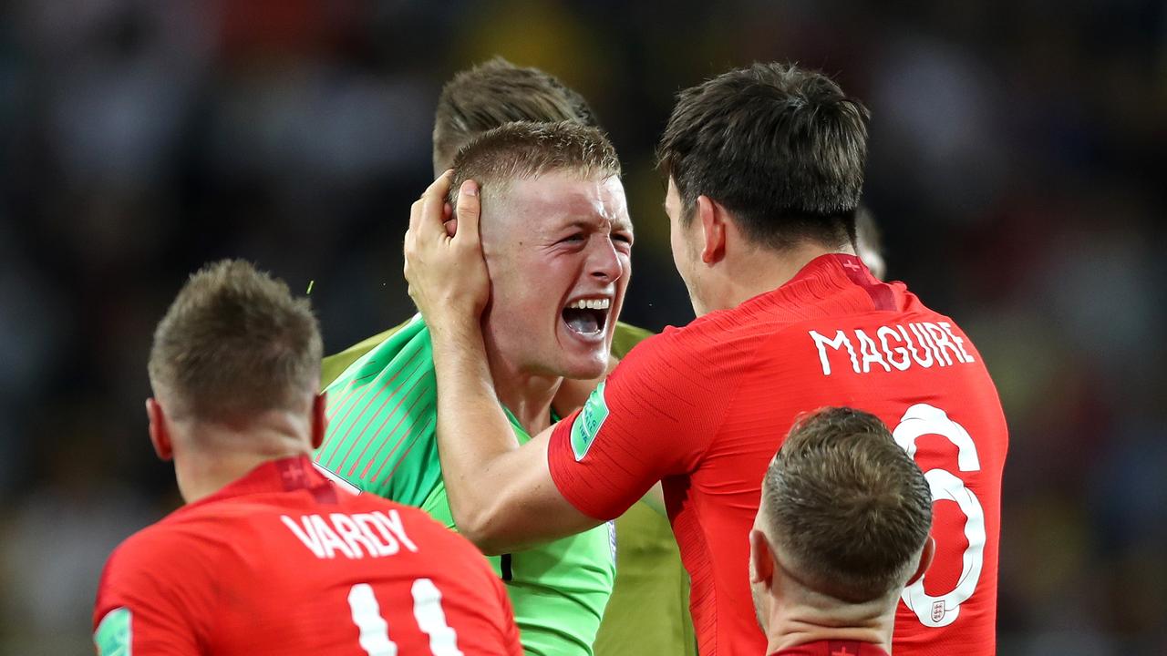 Jordan Pickford and Harry Maguire celebrate together.