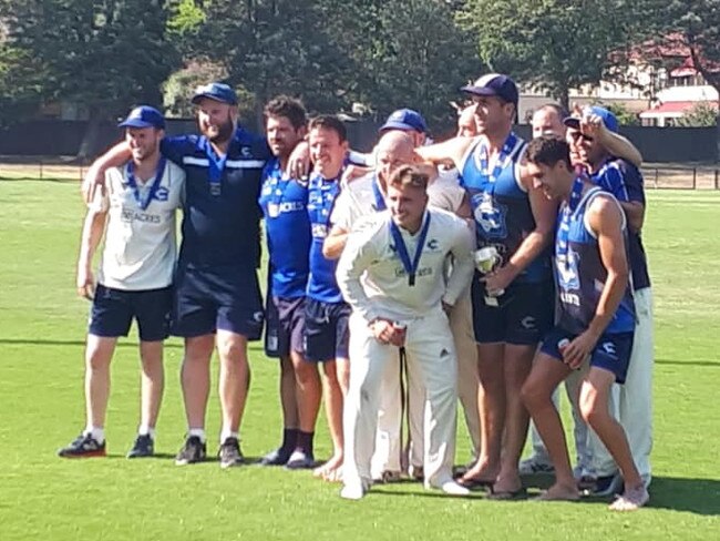 Cheltenham players celebrate their premiership.