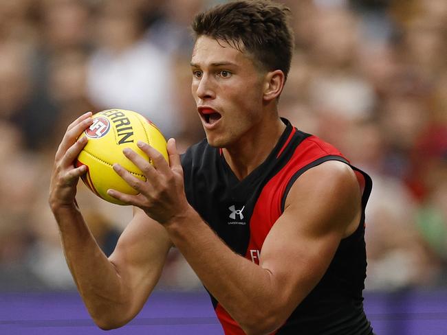 MELBOURNE, AUSTRALIA - MARCH 19: Archie Perkins of the Bombers in action during the round one AFL match between Hawthorn Hawks and Essendon Bombers at Melbourne Cricket Ground, on March 19, 2023, in Melbourne, Australia. (Photo by Jonathan DiMaggio/AFL Photos/via Getty Images)