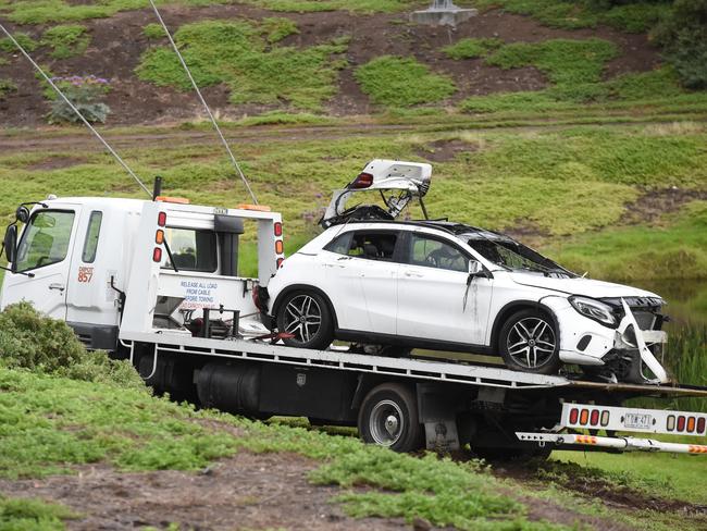 Police divers and SES crew worked hard to pull the car from the water. Picture: Tony Gough