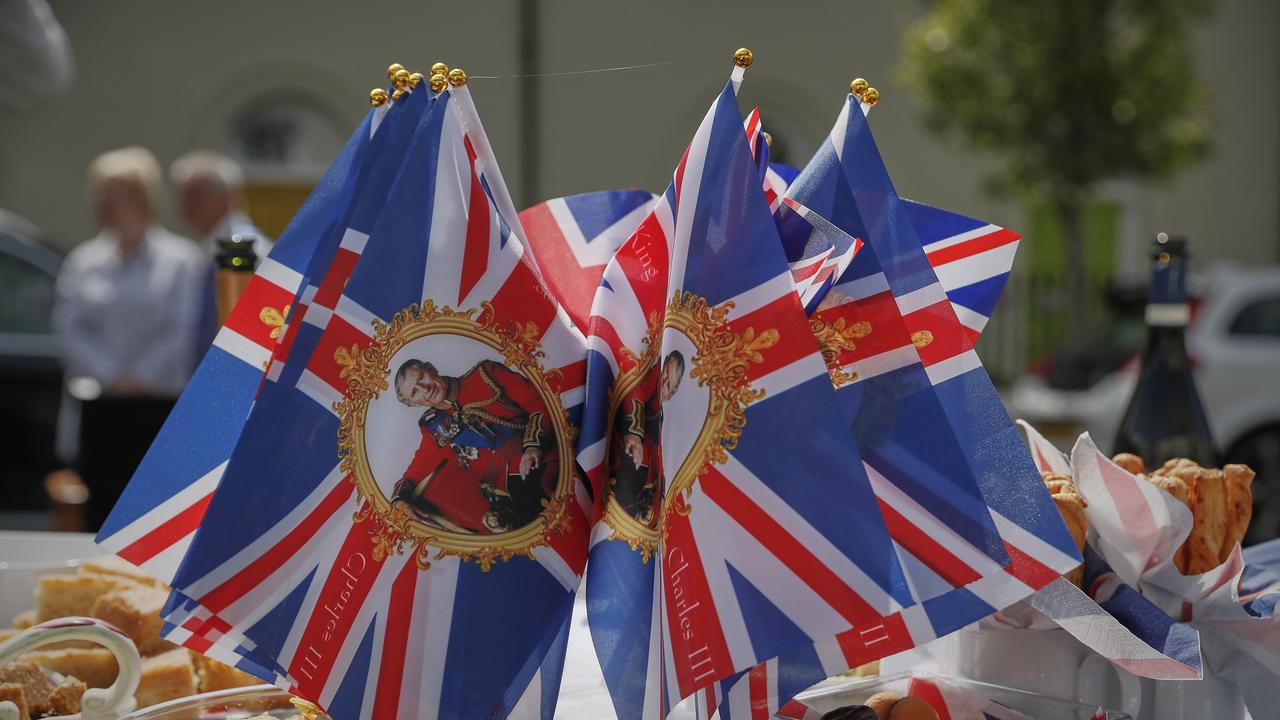 Union flags with the portrait of King Charles III sit on a table during a street party. Picture: Getty Images