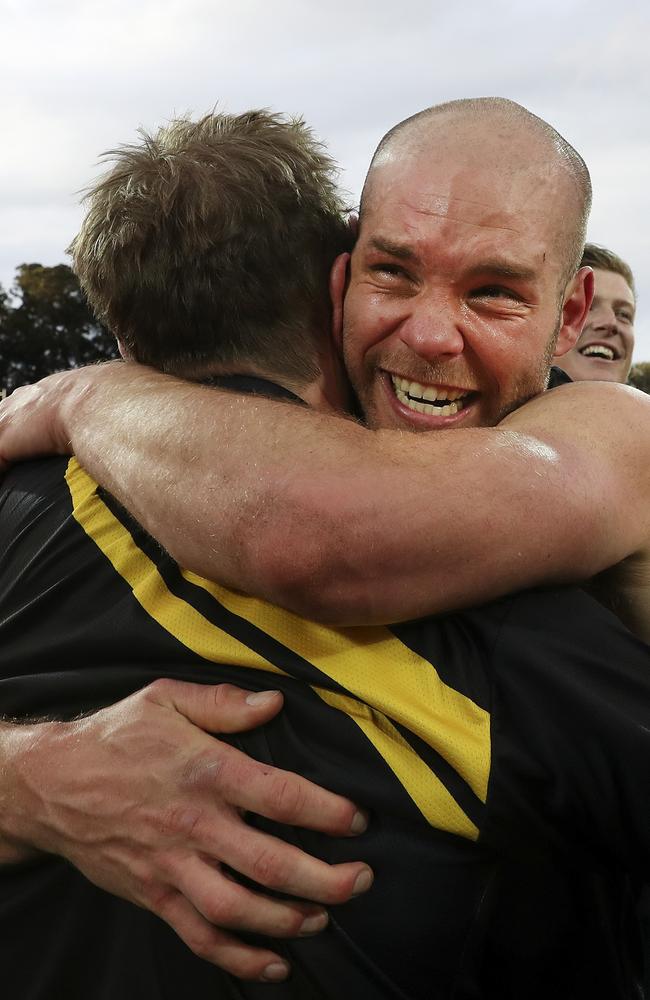 Aaron Joseph hugs Mark Stone after the Tigers beat the Magpies in the SANFL grand final. Picture: Sarah Reed.