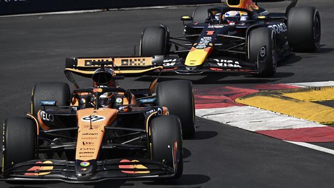 Oscar Piastri steers his car in front of Red Bull driver Max Verstappen. Picture: Gabriel Bouys/Pool Photo via AP