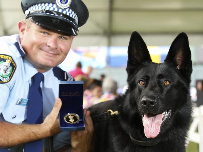 Senior Constable David Wynne with Police dog ÔUlrichÕ at the Royal Easter Show today after being awarded the inaugural 2016 Royal Agricultural Society Canine Hero Award. Picture: Justin Lloyd