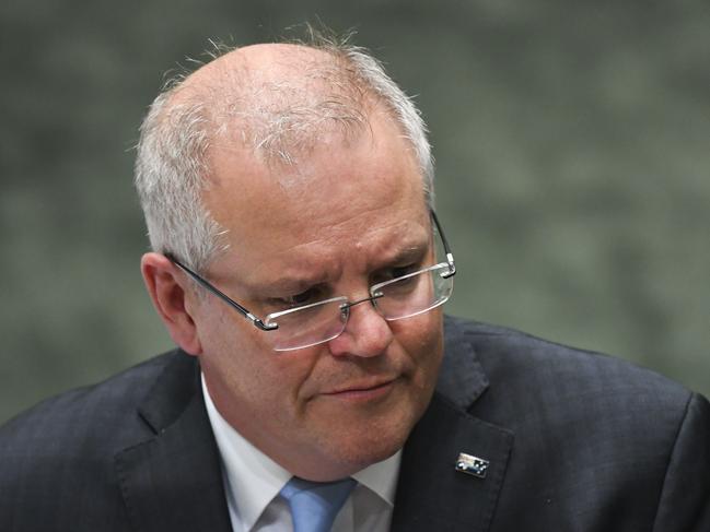 Australian Prime Minister Scott Morrison reacts during House of Representatives Question Time at Parliament House in Canberra, Wednesday, April 8, 2020. (AAP Image/Lukas Coch) NO ARCHIVING