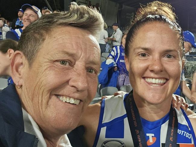 Sal Rees with North Melbourne Premiership Captain Emma Kearney after the 2024 AFLW Grand Final.