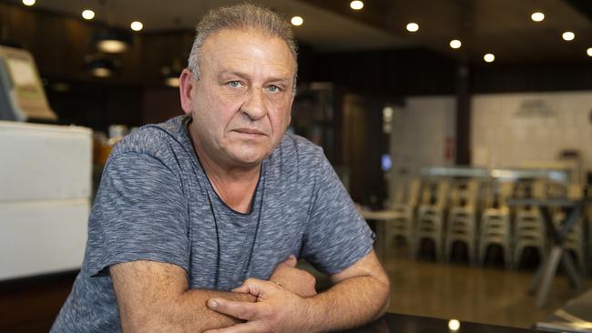 Business man Peter gave out $100 notes to each person queuing at Box Hill Centrelink on Wednesday. Picture: Sarah Matray