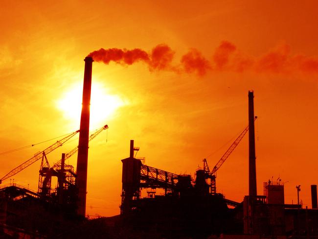 Xstrata's MIM mine is seen as sun sets over city at Mount Isa in Queensland.