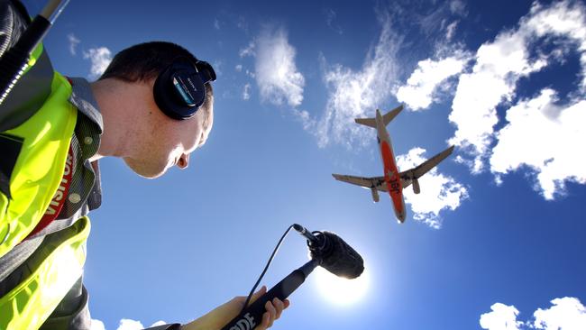 Lawrence English recording jet aircraft sounds near a runway in and around airport in Brisbane. A new community group says noise from the second runway is ruining lives. File Photo