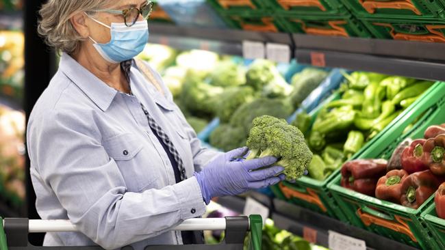 A woman wears a face mask at a supermarket. File image.