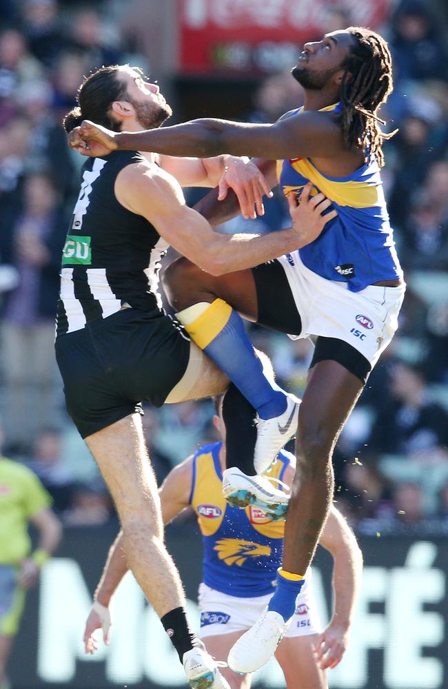 Nic Naitanui and Brodie Grundy fly in the ruck during their brief meeting late last season. Picture: Michael Klein.