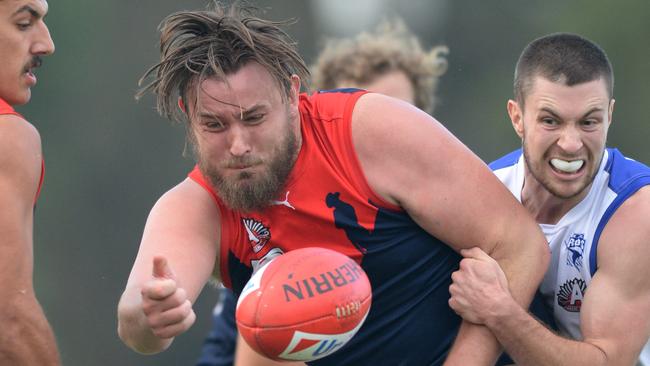 Andrew Haining is wrapped up in a tackle. Picture: Chris Eastman/AAP