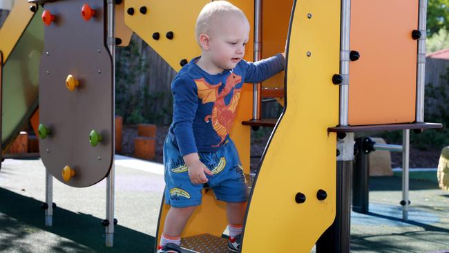 Kaye Fraser’s grandson Charlie Cox, 22 months, plays at Irving Street Reserve. Picture: Angelo Velardo