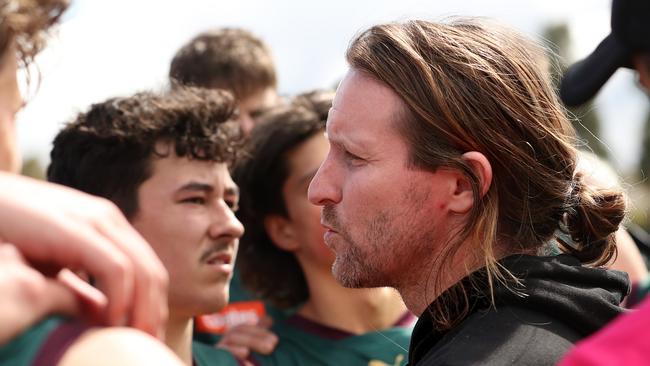 MELBOURNE, AUSTRALIA - SEPTEMBER 09: Jeromey Webberley, Coach of the Tassie Devils speaks to players during the Coates Talent League Boys Quarter Final match between Tasmania Devils and Gippsland Power at Highgate Reserve on September 09, 2023 in Melbourne, Australia. (Photo by Kelly Defina/AFL Photos/via Getty Images )
