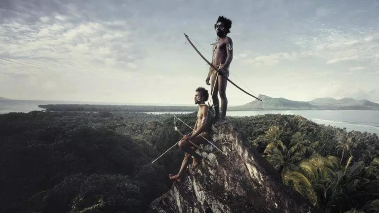 The Ni tribe in Vanuatu on a rock where they can easily pick off their prey. Picture: Jimmy Nelson
