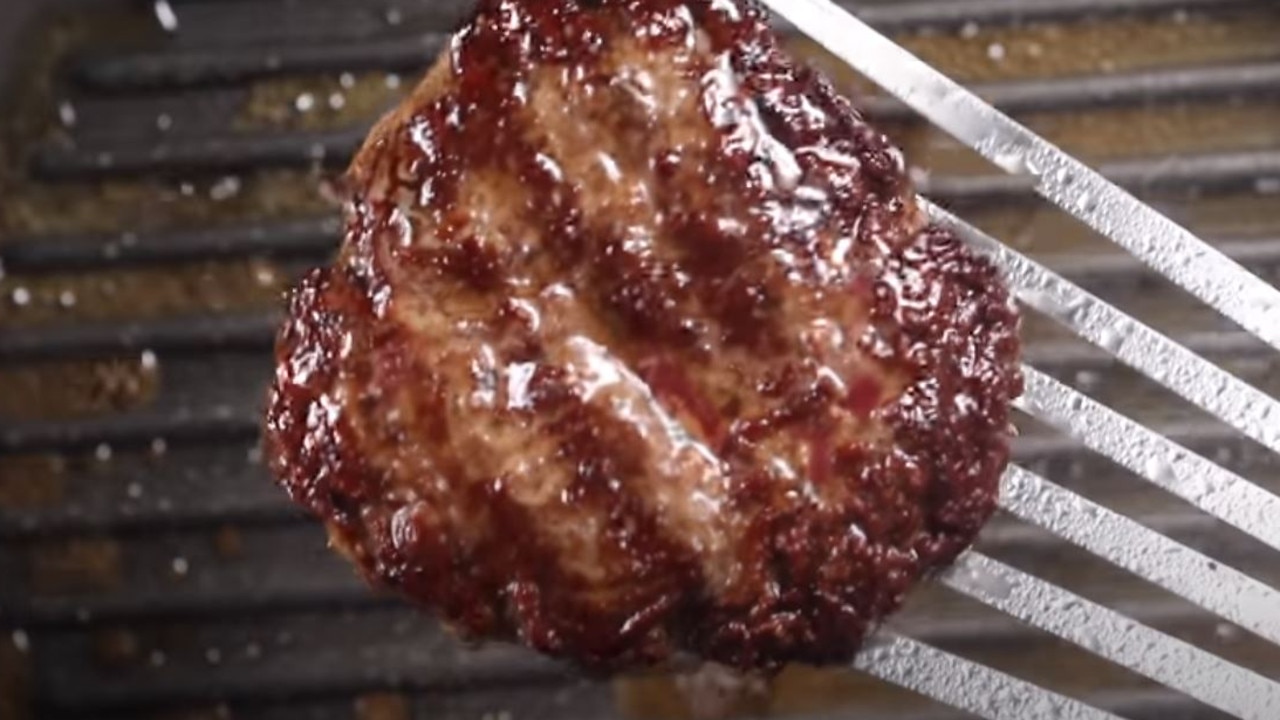 Cook the burger on a high heat in a griddle pan to get the signature chargrilled taste at home. Picture: YouTube / Nicko's Kitchen