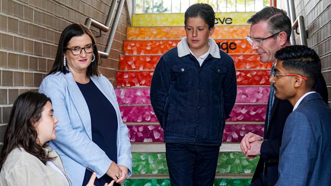 Premier Dominic Perrottet (second from left) and Education Minister Sarah Mitchell (second from right) at Putney Public School on Monday.