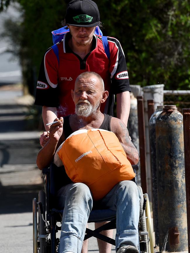 A local man (in wheelchair) said he knew of the alleged dispute that led to the shooting. Picture: Nicole Garmston