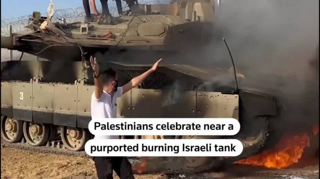 Palestinians celebrate near purported Israeli tank