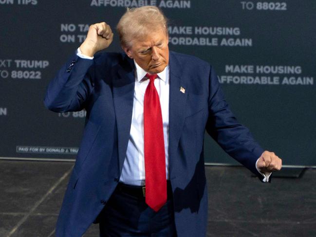 Former US President and Republican presidential candidate Donald Trump dances as he leaves after speaking during a campaign event at the Tucson Music Hall in Arizona on Thursday. Picture: AFP