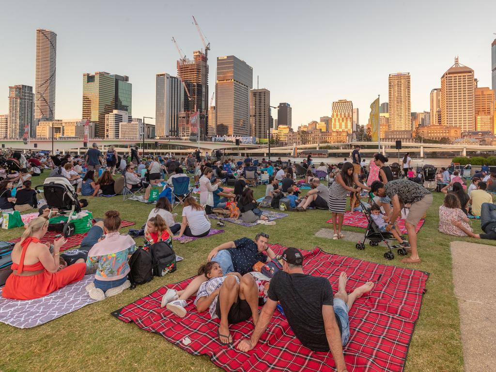 People gather to watch the New Year's Eve Fireworks during dusk at Southbank in Brisbane. Picture: Glenn Hunt