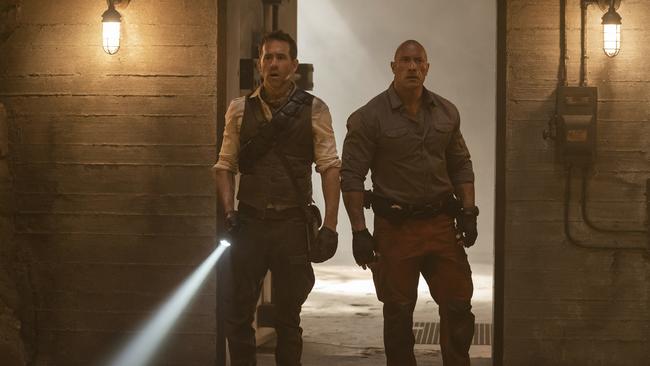 Ryan Reynolds as Nolan Booth and Dwayne Johnson as John Hartley in Red Notice. Picture: Frank Masi/Netflix