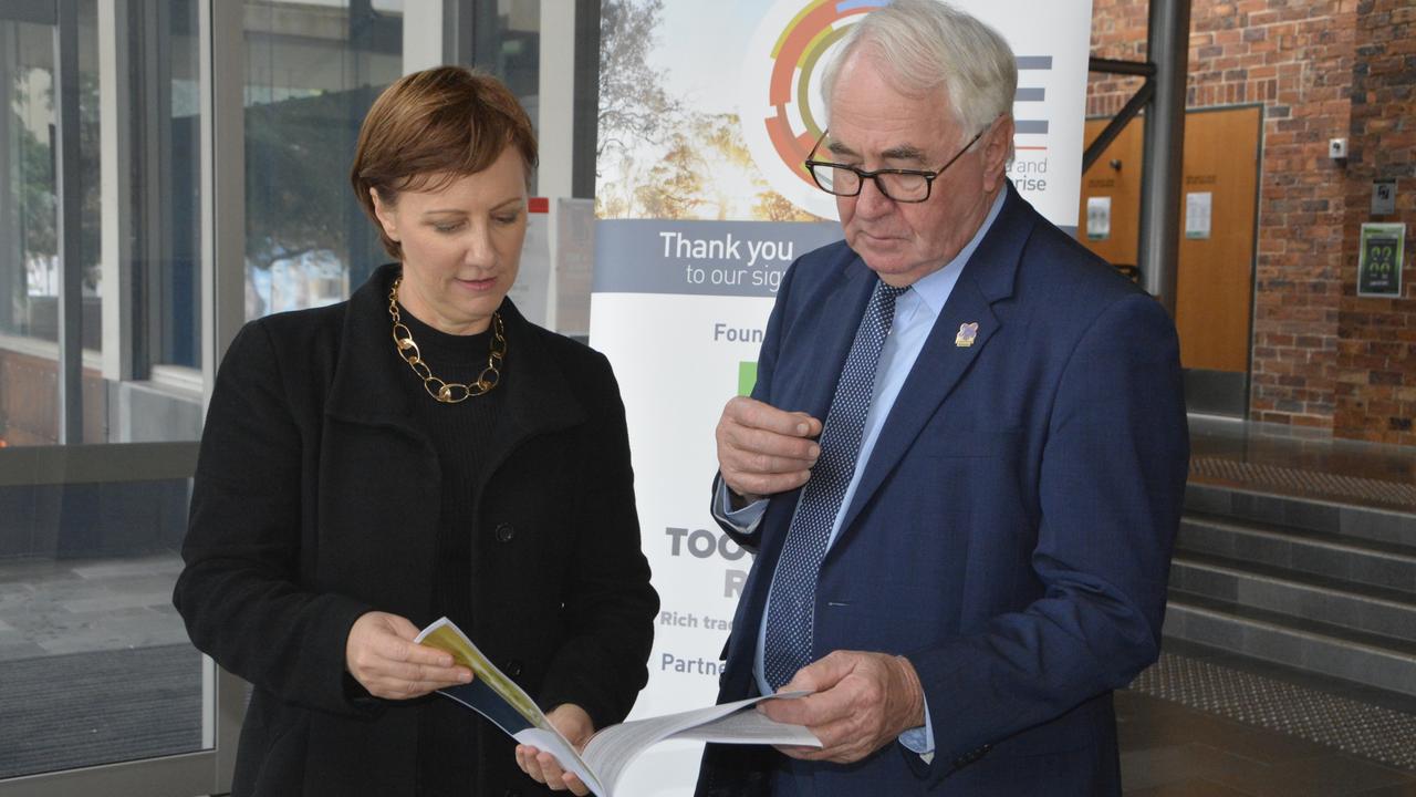 REPORT READY: TSBE CEO Ali Davenport and Toowoomba Mayor Paul Antonio inspect the Brisbane 2032 Olympic Games Toowoomba Capability Review.