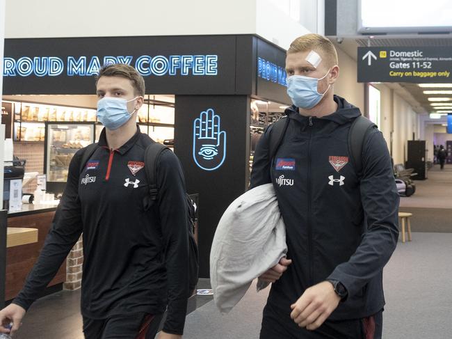 MELBOURNE, AUSTRALIA - NewsWire Photos MAY 26, 2021: Essendon players are seen walking to board a plane for Perth, at Tullamarine airport.Picture: NCA NewsWire / Luis Enrique Ascui