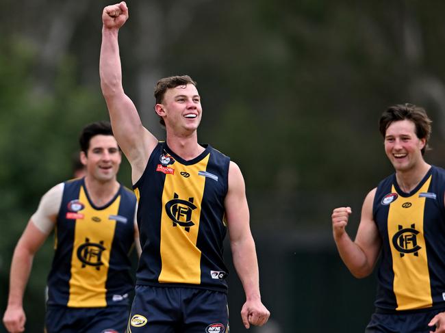 Joel Naylor kicks a goal for Hurstbridge. Picture: Andy Brownbill