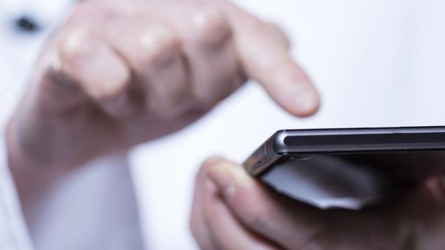 Close-up of hands of doctor using phone in hospital Photo: iStock