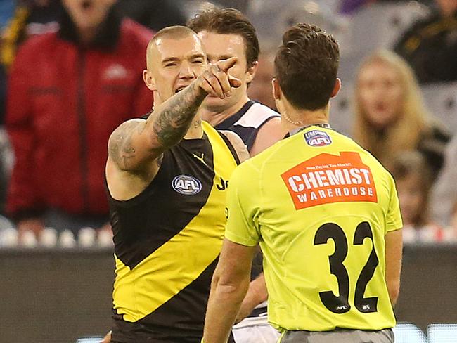 AFL Round 13. 17/06/2018.  Geelong v Richmond at the MCG .   Richmond's Dustin Martin tells field umpire Jacob Mollison to look at the big screen after Mollison awarded Geelong's Patrick Dangerfield a free kick for in the back   . Pic: Michael Klein