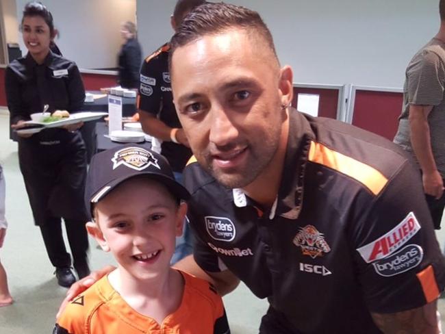 Wests Tigers fan Max McWilliams with Benji Marshall.