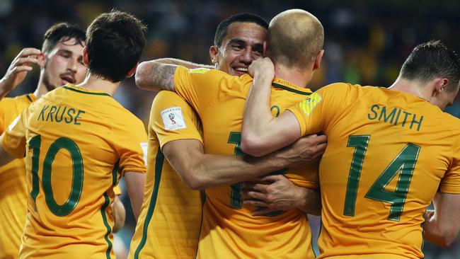 Socceroos players celebrate after Aaron Mooy (second from right) scored against Jordan in their World Cup qualifier against Jordan at Allianz Stadium in March.