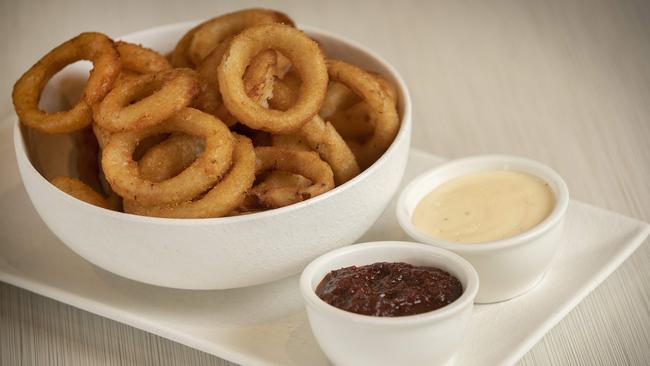 Doctor Syntax’s crispy, golden onion rings are served with sides of aioli and tomato relish. Picture: Chris Kidd