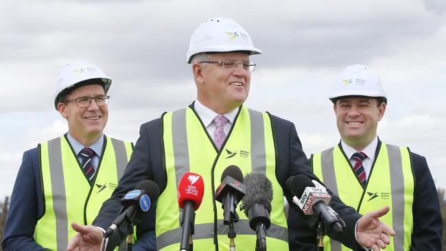 Minister Alan Tudge, Prime Minister Scott Morrison and Minister Stuart Ayres pictured at Badgerys Creek to launch the start of digging for the construction of the Western Sydney Airport site. Picture: Richard Dobson