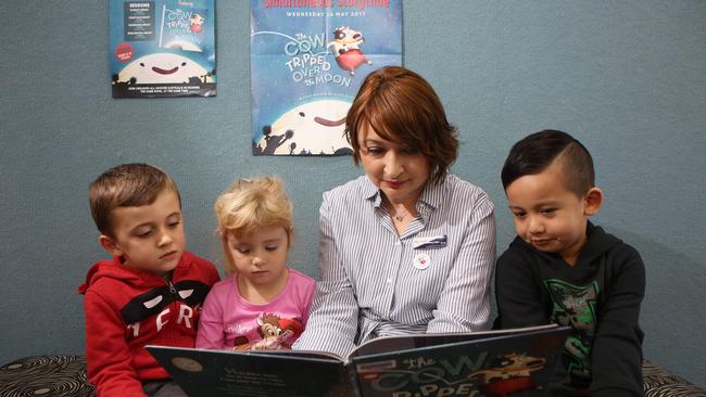 Campbelltown Library Officer Eva Resiak reads a book to kids.