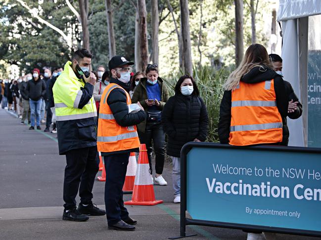 People line up at Sydney's mass vaccination hub in Sydney Olympic Park.