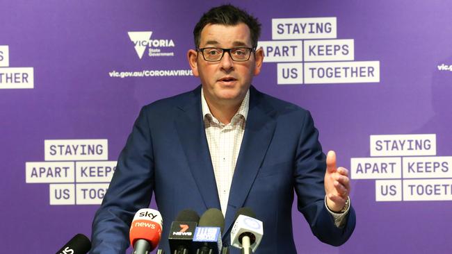 Daniel Andrews announced all inter­national flights would be diverted away from Melbourne for the next fortnight. Picture: Ian Currie