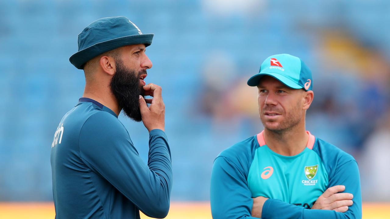 Out-of-form Australia opener David Warner chats with England’s Moeen Ali. Picture: Getty