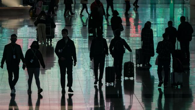 Travellers at Hong Kong’s international airport last week. Picture: Getty Images