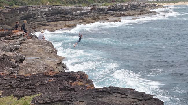 One boy takes a leap of faith at Curl Curl. Picture by Edita Pahor