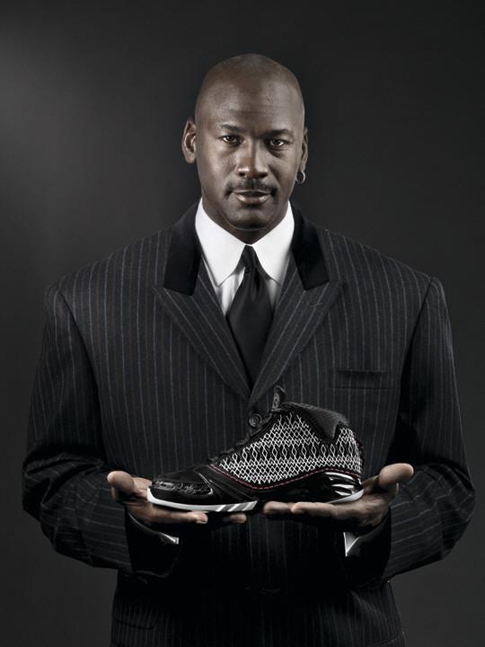 Michael Jordan poses with the Tinker Hatfield designed Air Jordan XX3 basketball shoe.