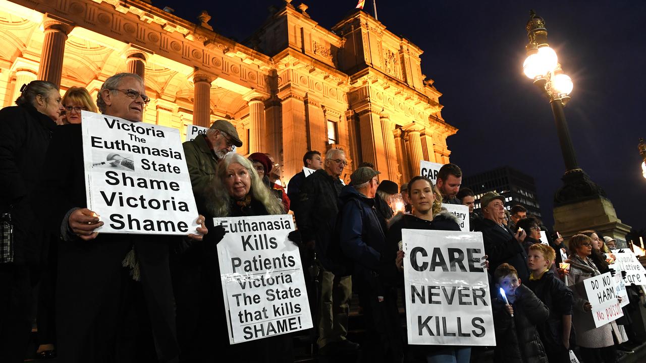 Pro-life demonstrators outside Victoria’s Parliament House on Tuesday night. Picture: AAP/James Ross